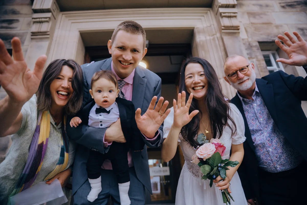 Newlyweds celebrating with family outside Sale Town Hall