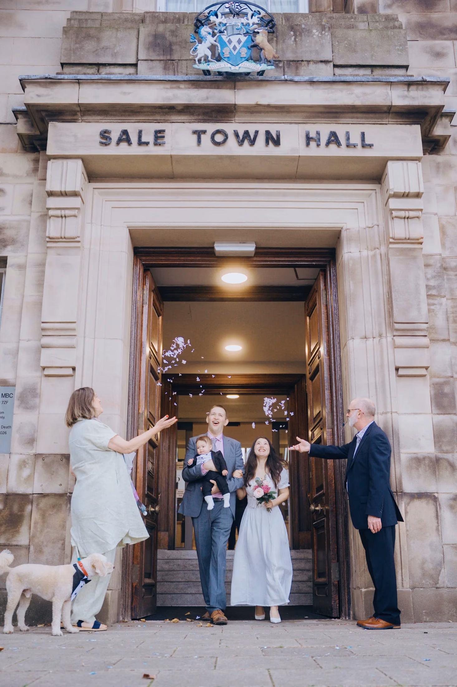 Newlyweds and family outside Sale Town Hall
